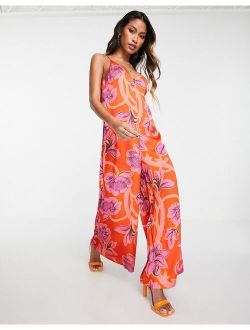 large outlined plunge jumpsuit in pink and red