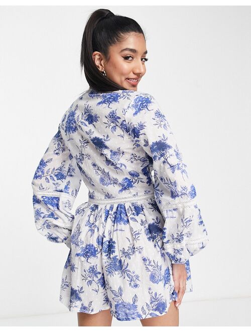 ASOS DESIGN lace insert tea romper in blue and white floral print