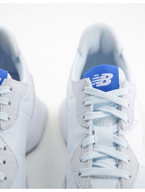 New Balance 327 trainers in blue and white