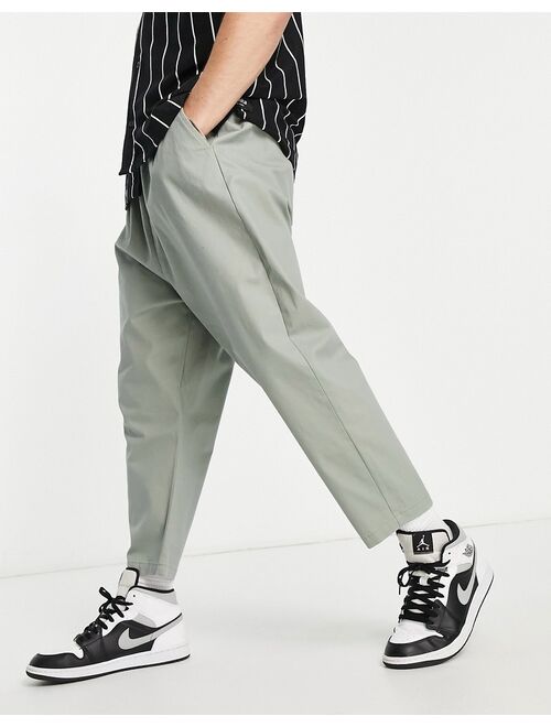 ASOS DESIGN drop crotch chinos in light green