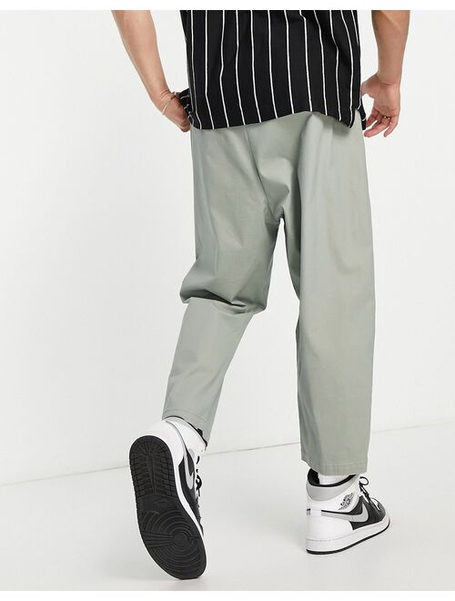 ASOS DESIGN drop crotch chinos in light green