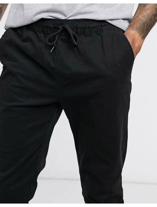 ASOS DESIGN slim chinos with elastic waist in black