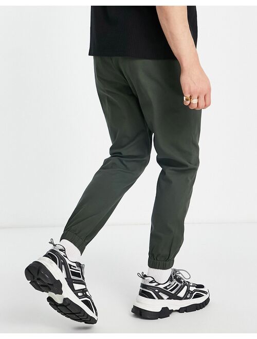 ASOS DESIGN tapered chino joggers with elastic waist in dark green