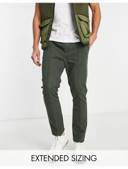 skinny chinos with pin tuck and elastic waist in dark green