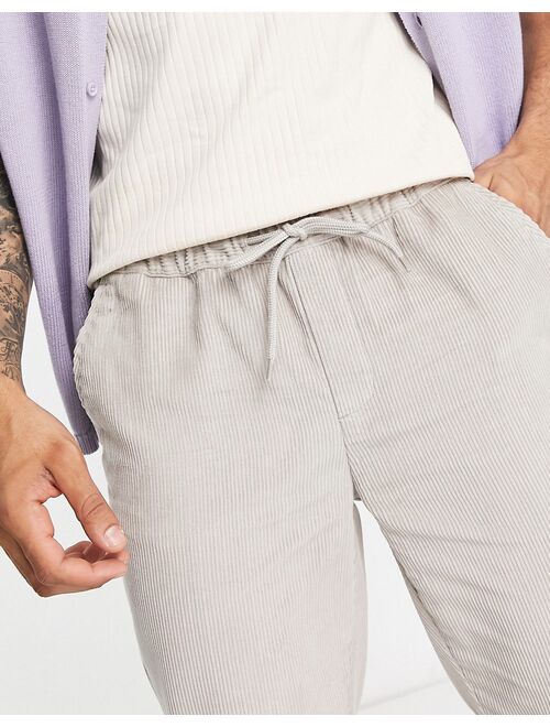 ASOS DESIGN slim cord pants in warm gray