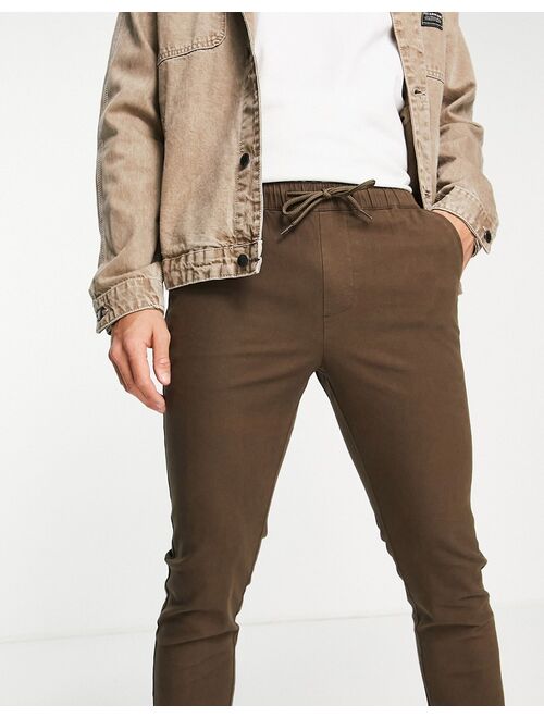 ASOS DESIGN slim fit chino pants with elasticated waist in dark brown