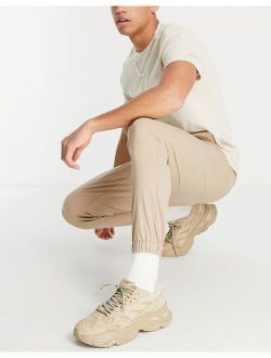 tapered chino joggers in warm beige