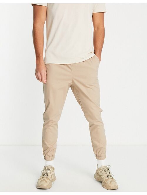 ASOS DESIGN tapered chino joggers in warm beige