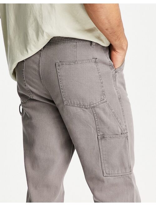 ASOS DESIGN skater pants in washed twill with carpenter pockets