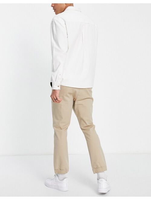 ASOS DESIGN tapered chino sweatpants in beige
