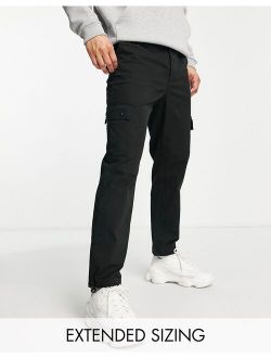 tapered cargo pants in black with toggles