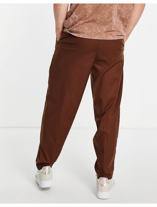 New Look oversized fit pleated smart pants in brown