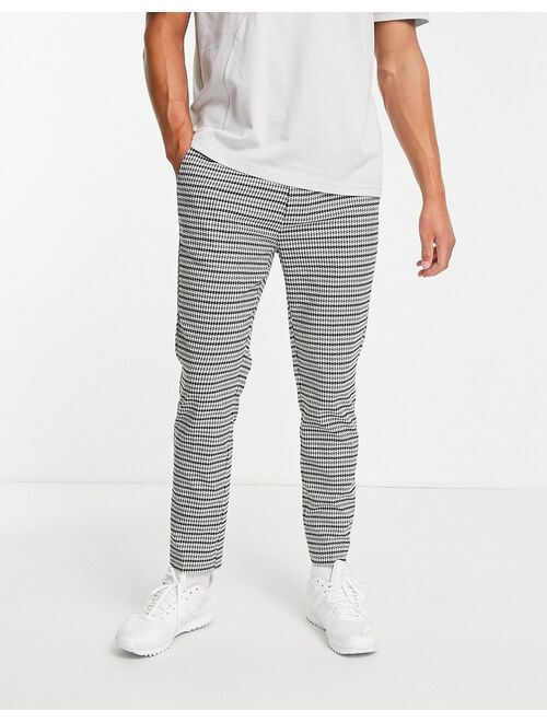 Topman skinny jogger-style pants in dogstooth check in black and white