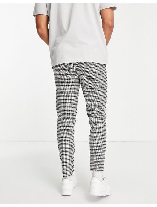 Topman skinny jogger-style pants in dogstooth check in black and white