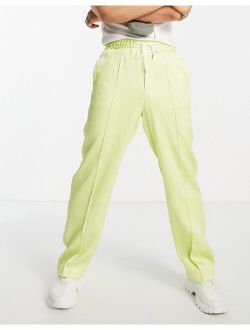 wide leg plisse pants with rubber drawstring in citrus yellow