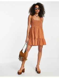 shirred mini sundress with tiers in rust spot print