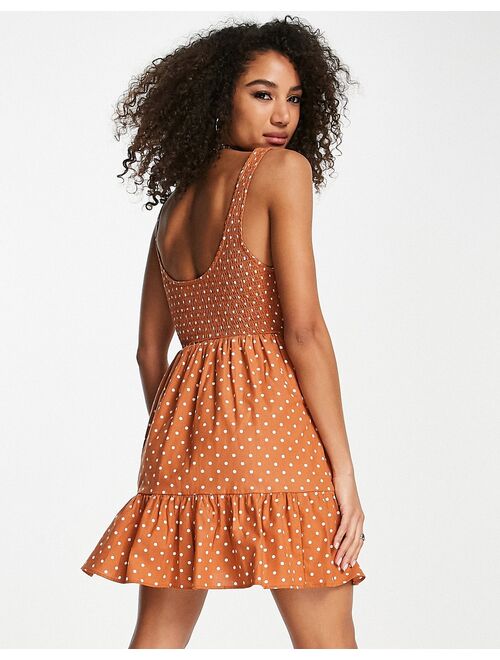 ASOS DESIGN shirred mini sundress with tiers in rust spot print