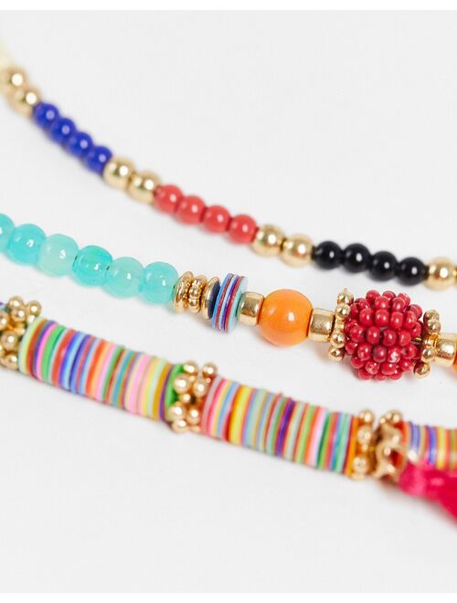 ASOS DESIGN pack of 6 anklets in multicolour beads with tassel and shell charms in gold tone