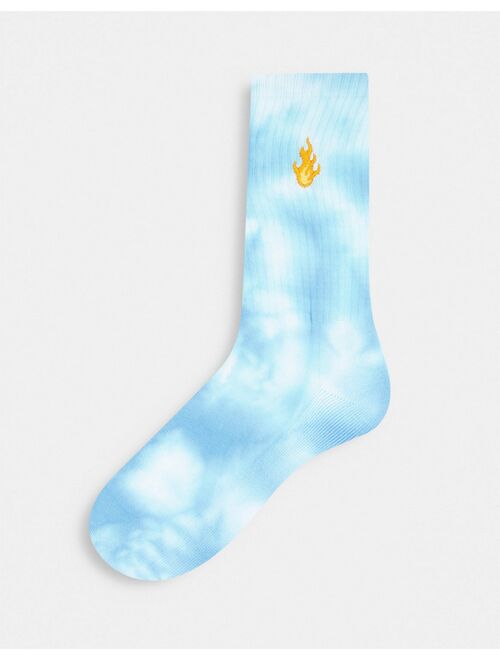 ASOS DESIGN blue tie dye sports sock with flame embroidery