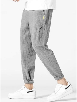 Men Letter Patched Detail Textured Tapered Pants