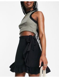 ruffle wrap mini skirt in black