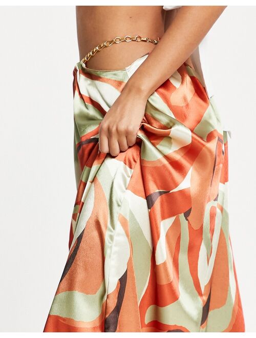 ASOS DESIGN satin midaxi skirt with chain detail in swirl print
