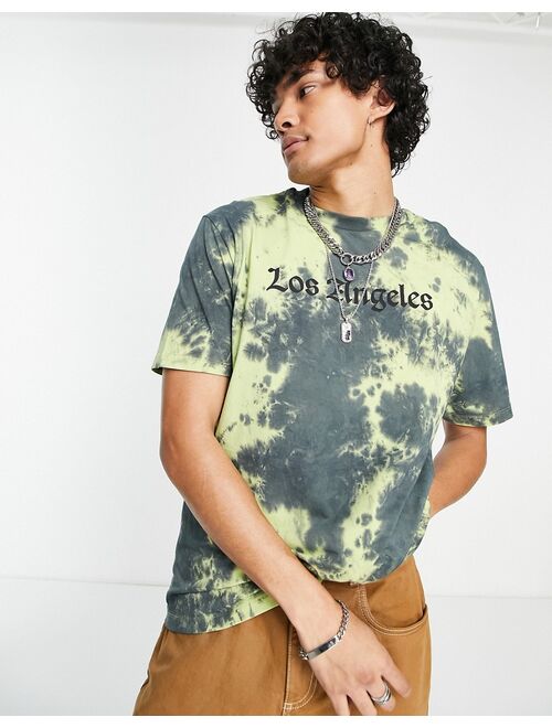 ASOS DESIGN relaxed t-shirt in washed black & yellow tie dye