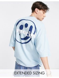 ASOS Daysocial oversized t-shirt with smiley graphic print in blue