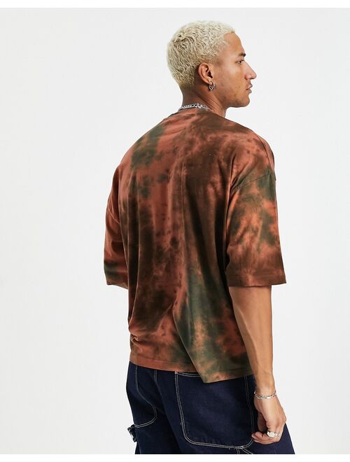 ASOS DESIGN oversized t-shirt in green and orange tie dye with front print