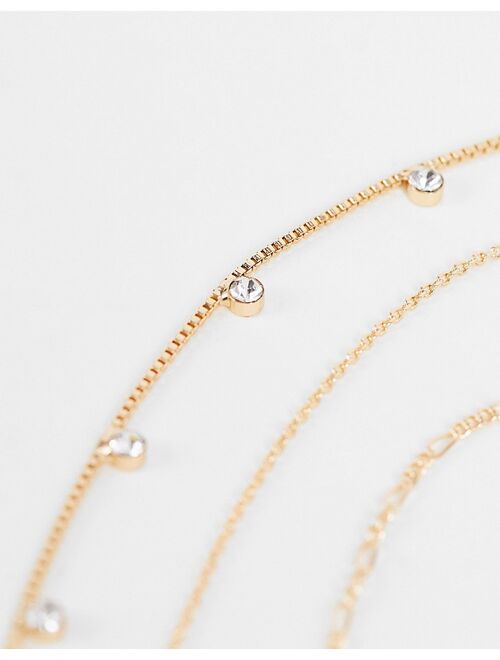 ASOS DESIGN 3-pack necklaces with opal design chain and mini cross in gold tone