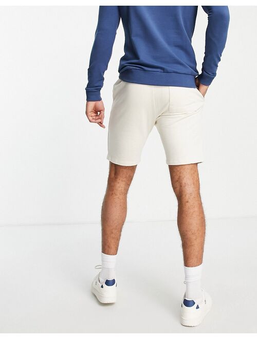 ASOS DESIGN jersey skinny shorts with pintucks in beige