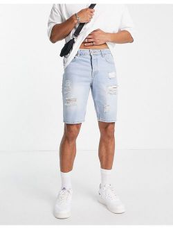 stretch slim denim shorts with rips in light wash blue