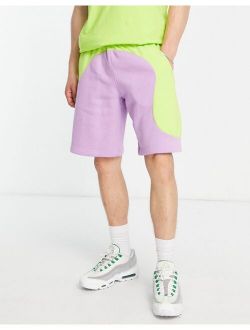 Color Clash colorblock shorts in lime