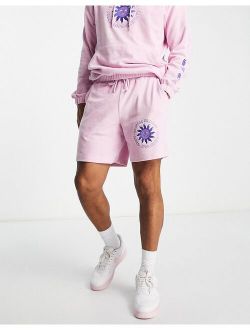 relaxed terrycloth shorts with embroidery detail in pink