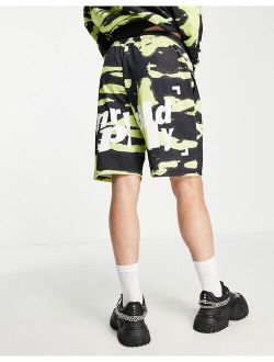 ASOS Unrvlld Spply longline jersey shorts with logo in all-over print in green - part of a set