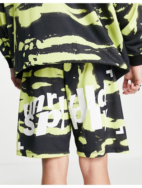 ASOS DESIGN ASOS Unrvlld Spply longline jersey shorts with logo in all-over print in green - part of a set