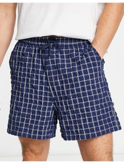 wide shorts in textured navy check
