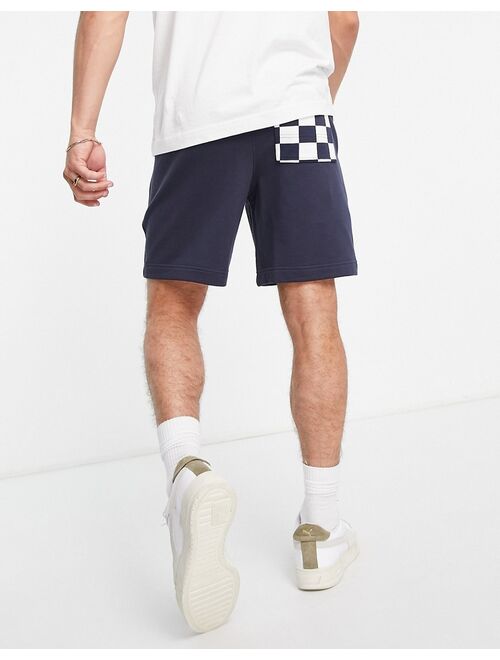 PUMA Downtown shorts in checkerboard color block in navy and white