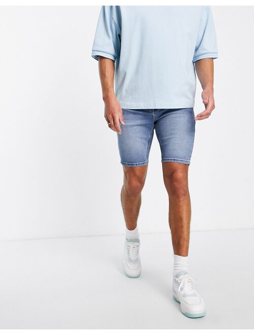 ASOS DESIGN skinny denim shorts in mid wash blue