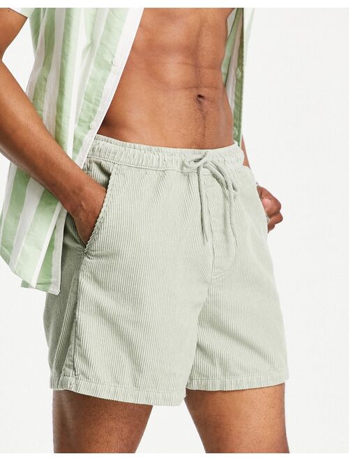 ASOS DESIGN wide fit shorts in light green cord