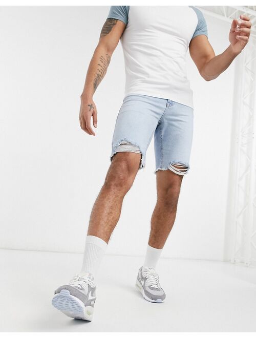ASOS DESIGN slim denim shorts in light wash blue with raw hem
