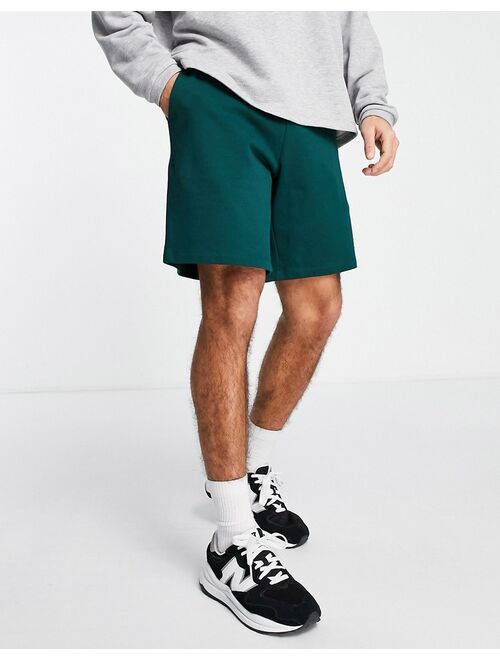 ASOS DESIGN oversized jersey shorts in dark green