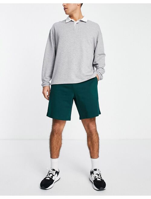 ASOS DESIGN oversized jersey shorts in dark green