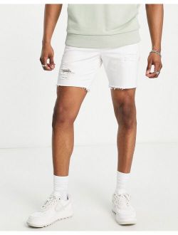 skinny shorts with rips in white