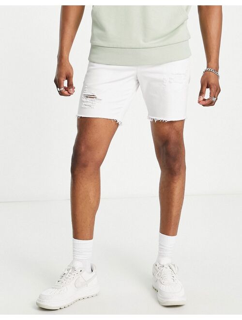 ASOS DESIGN skinny shorts with rips in white