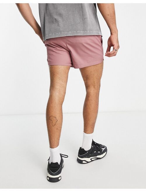 ASOS DESIGN skinny runner chino shorts with elasticated waist in rust red