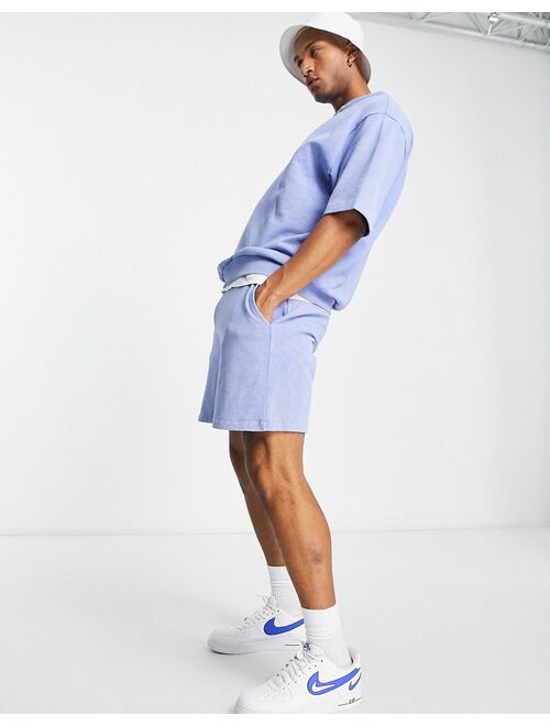 ASOS DESIGN relaxed shorts in blue acid wash