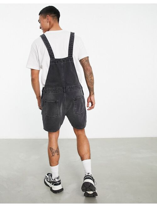 ASOS DESIGN short denim overalls in washed black with heavy rips