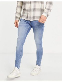 super spray on jeans in mid wash