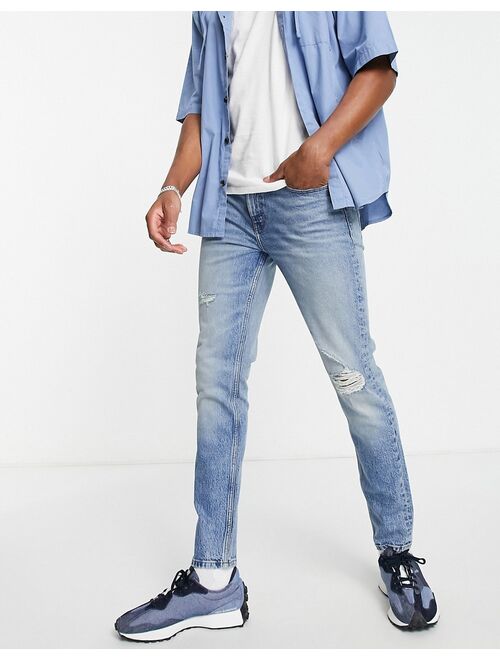 ASOS DESIGN Cone Mill Denim skinny fit American classic jeans in 90s mid wash with abrasions